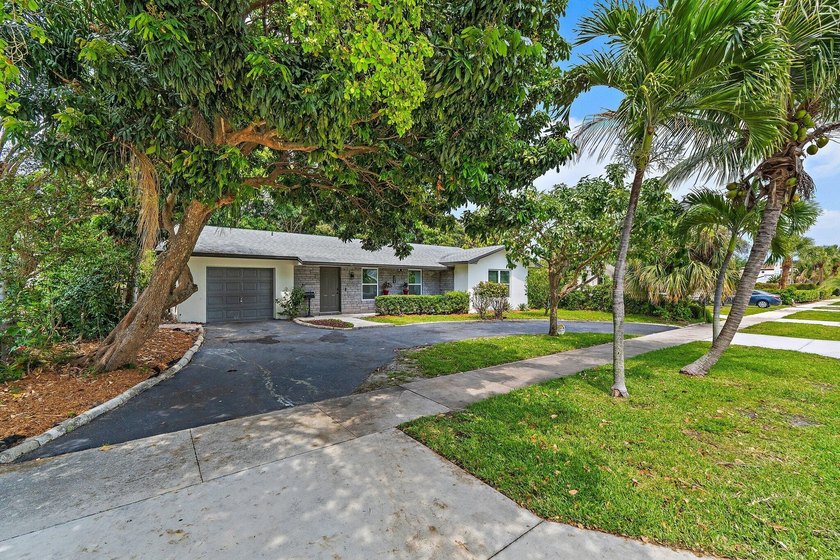 Move right in to this beautifully updated one-level, three - Beach Home for sale in Lake Park, Florida on Beachhouse.com