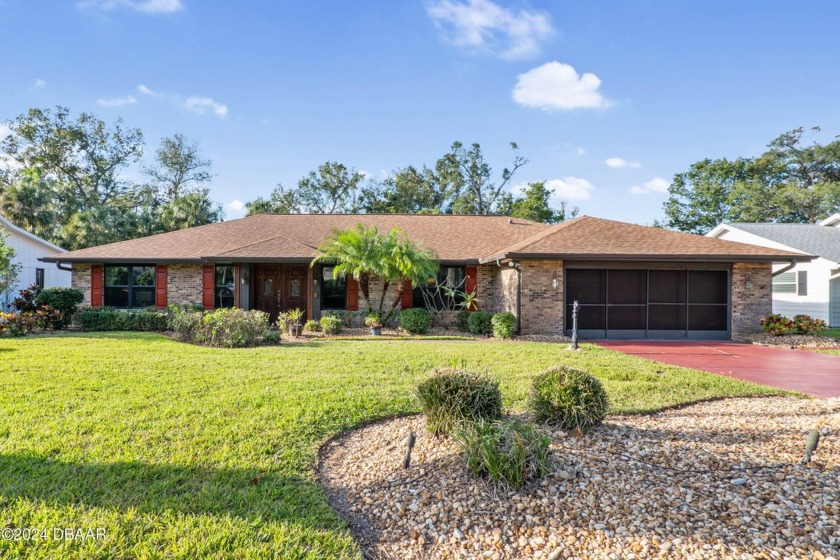 This beautiful brick home, nestled in the prestigious gated - Beach Home for sale in Port Orange, Florida on Beachhouse.com