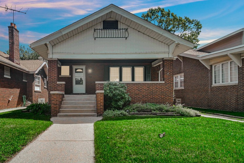 This charming 4-bedroom, 2.5-bathroom historic brick bungalow is - Beach Home for sale in Whiting, Indiana on Beachhouse.com