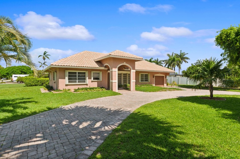 This stunning 3-bedroom, 2-bath single-family home boasts a - Beach Home for sale in Deerfield Beach, Florida on Beachhouse.com