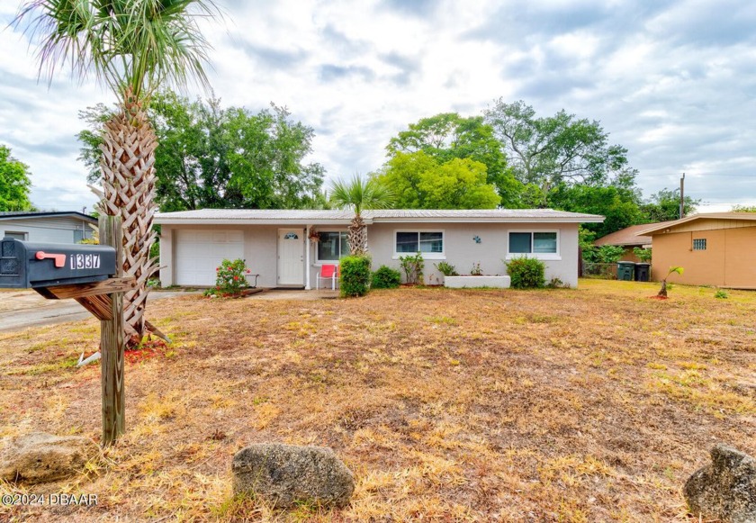 Welcome home to this adorable 3-bedroom gem with a large, fenced - Beach Home for sale in Daytona Beach, Florida on Beachhouse.com