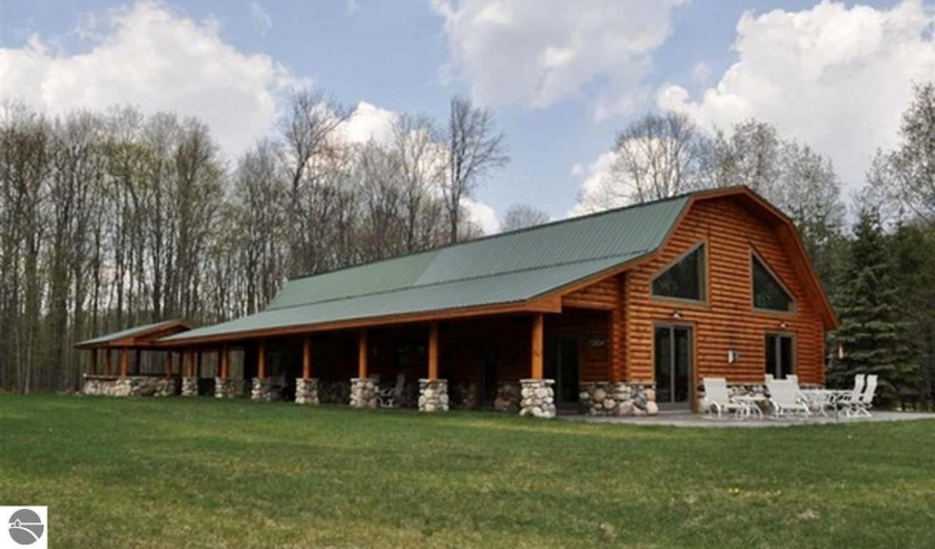 PRIVATE, BEAUTIFUL LOG HOME ON 30 ACRES, with several - Beach Home for sale in Alden, Michigan on Beachhouse.com