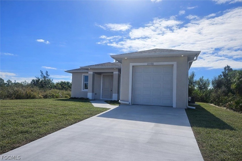 This brand-new 3-bedroom, 2-bathroom home sits on a spacious - Beach Home for sale in Lehigh Acres, Florida on Beachhouse.com