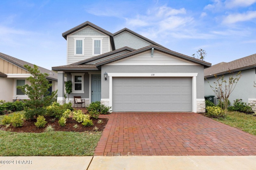 Welcome to 118 Pitching Wedge Drive, a stunning 2023-built home - Beach Home for sale in Daytona Beach, Florida on Beachhouse.com