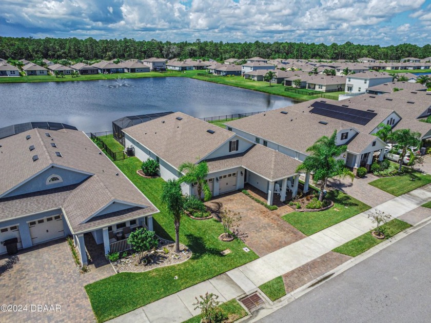 Come fall in love with this beautiful pool home overlooking a - Beach Home for sale in New Smyrna Beach, Florida on Beachhouse.com