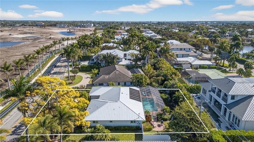 Perfectly positioned on prestigious South Golf Drive, this - Beach Home for sale in Naples, Florida on Beachhouse.com