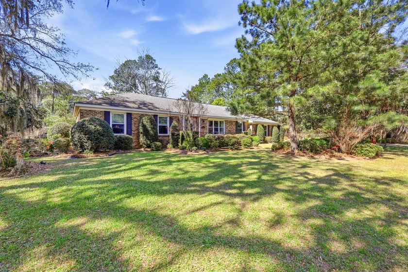 Welcome to this charming 3-bedroom, 2-bath brick ranch style - Beach Home for sale in Georgetown, South Carolina on Beachhouse.com
