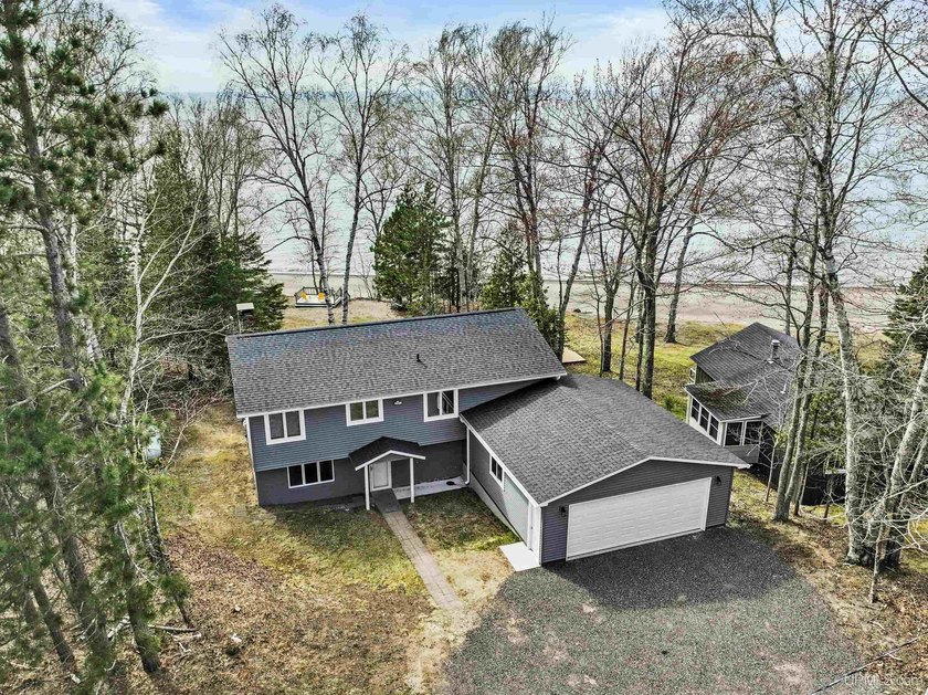 This well-kept Lake Superior home offers 100 feet of prime - Beach Home for sale in Calumet, Michigan on Beachhouse.com