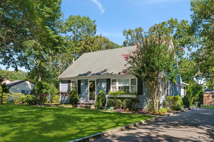 Nestled on a quiet, tree-lined street south of the highway, this - Beach Home for sale in Hampton Bays, New York on Beachhouse.com