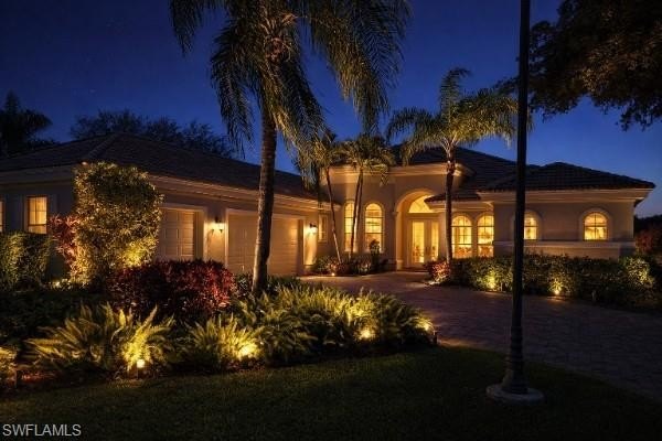 Sun-soaked pool days, long lake views, and a front-row backdrop - Beach Home for sale in Estero, Florida on Beachhouse.com