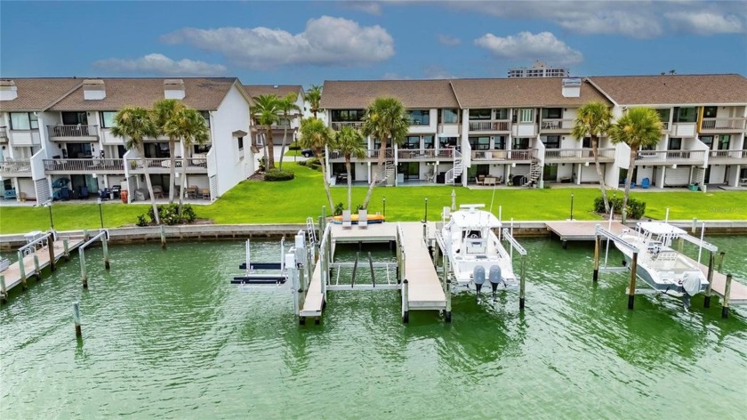 BRING YOUR BOAT AND YOUR LOVE FOR COASTAL LUXURY! This end unit - Beach Townhome/Townhouse for sale in Clearwater Beach, Florida on Beachhouse.com