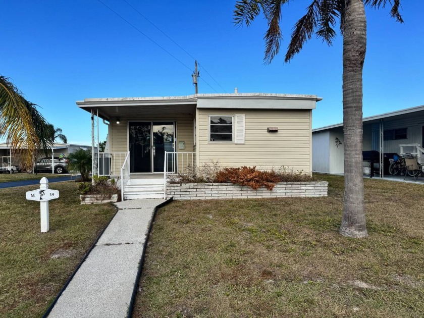 On a desirable corner lot, this charming two bedroom one - Beach Home for sale in Bradenton, Florida on Beachhouse.com