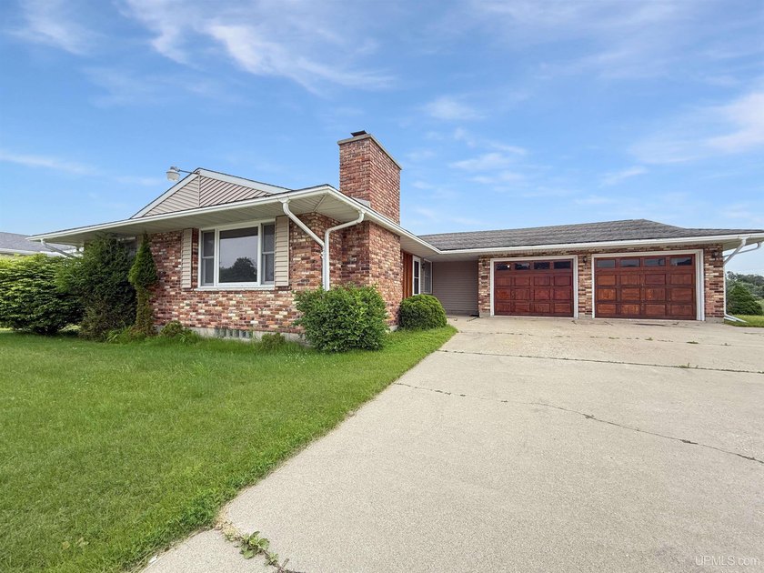 This spacious and versatile home offers endless possibilities - Beach Home for sale in Manistique, Michigan on Beachhouse.com