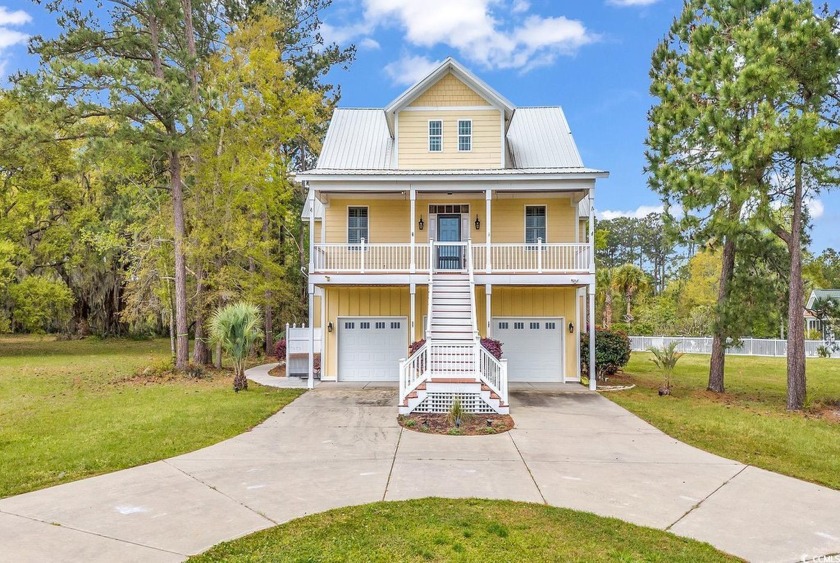 This excellently crafted four-bedroom residence is nestled - Beach Home for sale in Georgetown, South Carolina on Beachhouse.com
