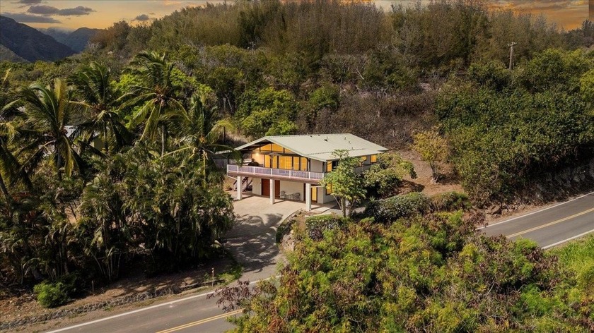 Set against a lush backdrop of tropical landscaping, this - Beach Home for sale in Wailuku, Hawaii on Beachhouse.com