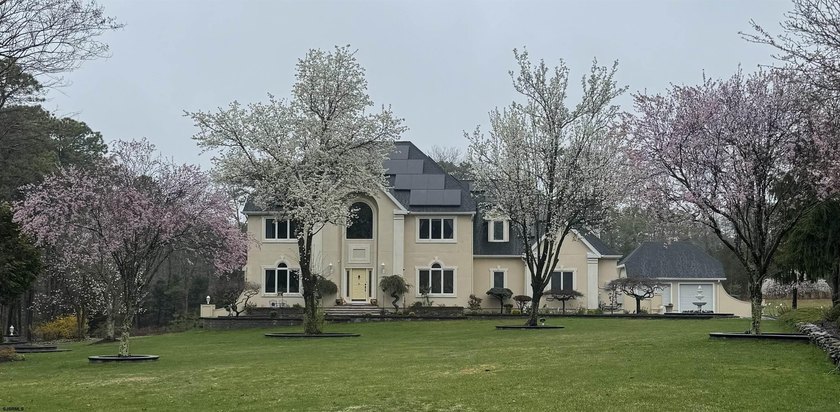 Positioned on over 2 pristine acres along the 13th hole of the - Beach Home for sale in Galloway, New Jersey on Beachhouse.com