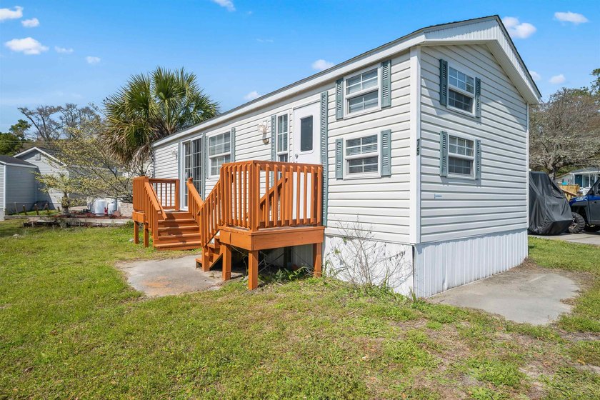 This charming and surprisingly spacious retreat is nestled in - Beach Home for sale in North Myrtle Beach, South Carolina on Beachhouse.com