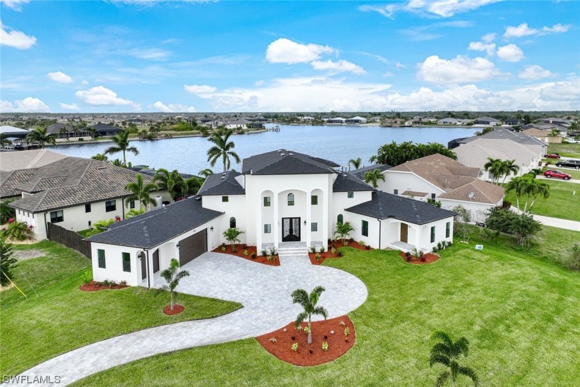 Welcome to this impressive newly constructed pool home on an - Beach Home for sale in Cape Coral, Florida on Beachhouse.com