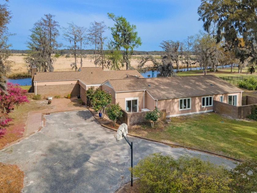 Experience sunsets like never before! This stunning single-story - Beach Home for sale in Pawleys Island, South Carolina on Beachhouse.com