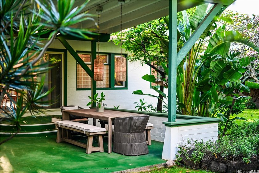 Tucked within a canopy of mature fruit trees and lush tropical - Beach Home for sale in Honolulu, Hawaii on Beachhouse.com