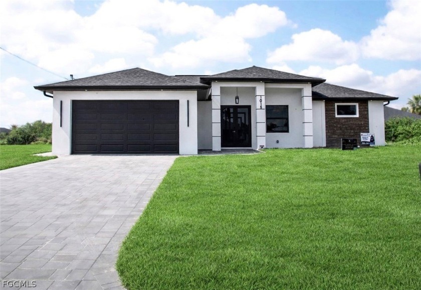 This elegant new construction home features four bedrooms, two - Beach Home for sale in Lehigh Acres, Florida on Beachhouse.com