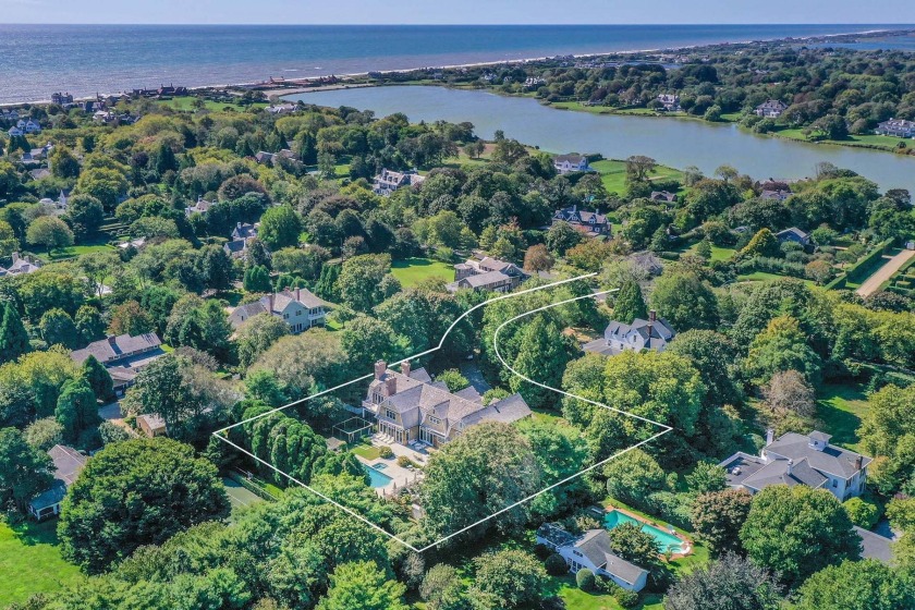 Down a long, hedge-lined drive with gated entry, the handsome - Beach Home for sale in Southampton, New York on Beachhouse.com