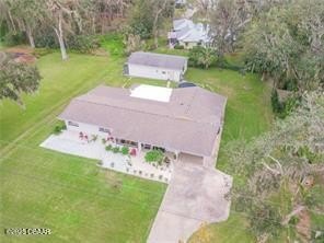 On nearly half an acre, this stunning 4-bedroom, 2-bath home in - Beach Home for sale in New Smyrna Beach, Florida on Beachhouse.com