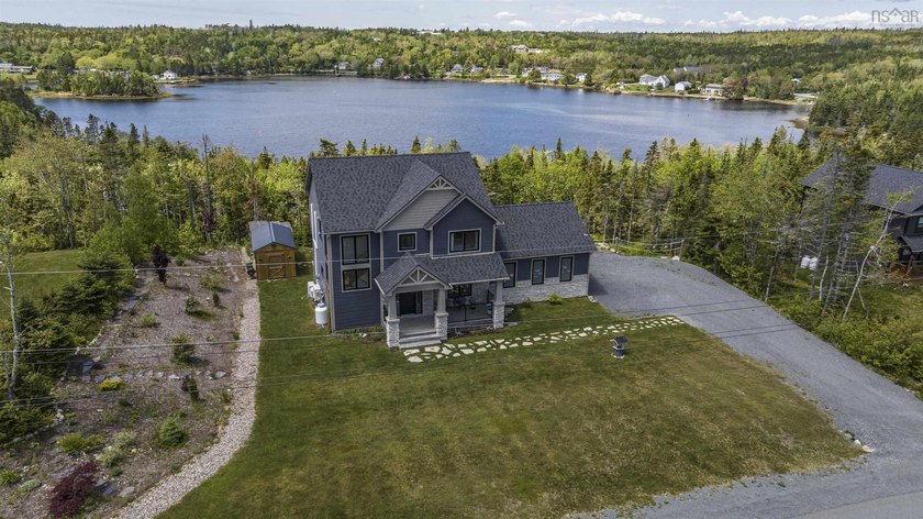 Striking vistas and a SW exposure on Prospect Bay deliver the - Beach Home for sale in Whites Lake, Nova Scotia on Beachhouse.com