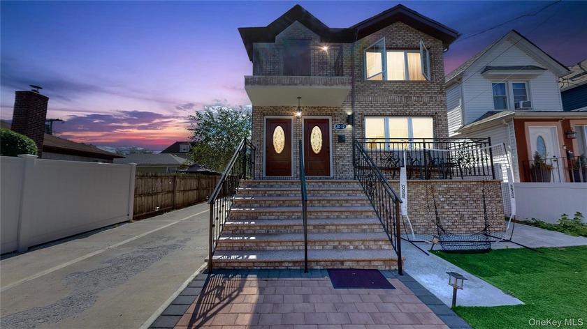 Welcome to this beautifully renovated two-family home in a prime - Beach Home for sale in Jamaica, New York on Beachhouse.com