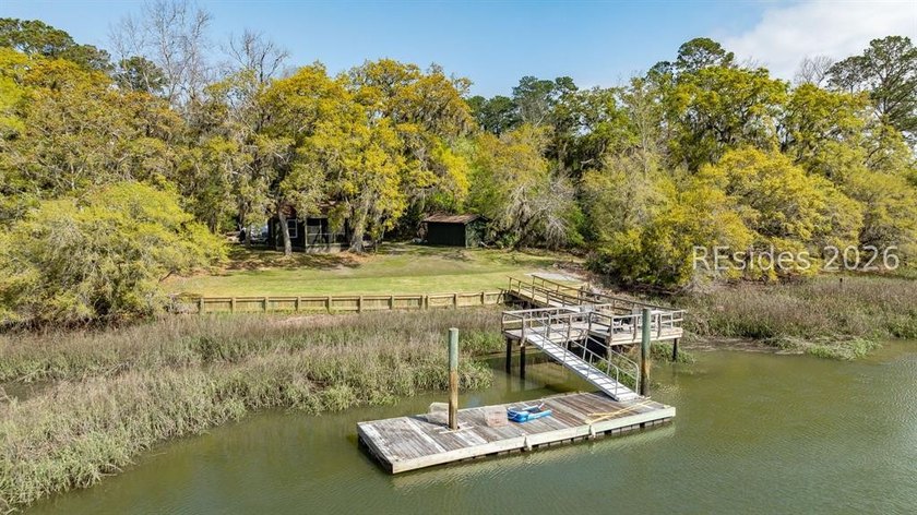 Charming marshfront cottage with a private dock! This freshly - Beach Home for sale in Okatie, South Carolina on Beachhouse.com