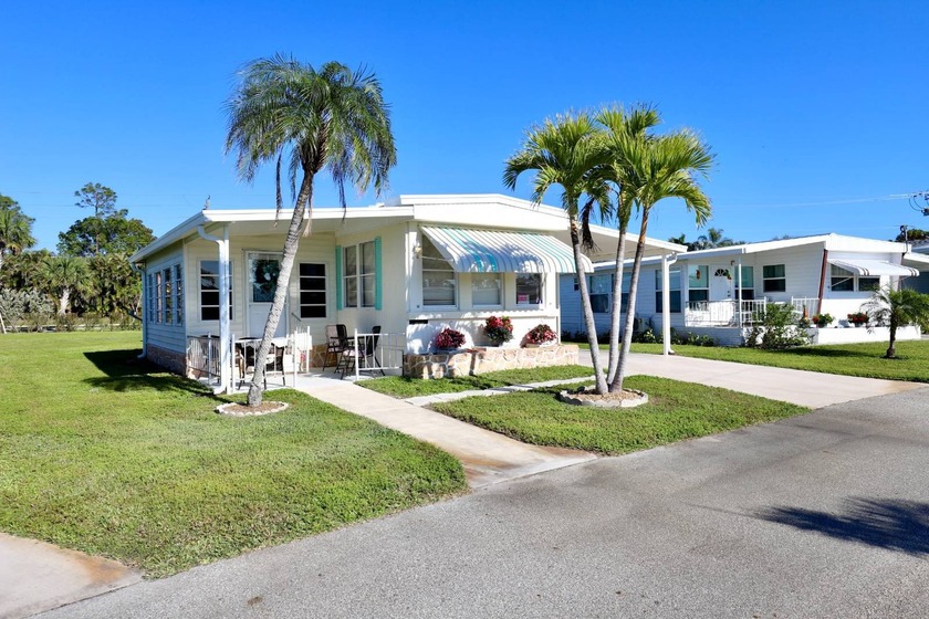 Charming Waterfront living in a 55+ community!        Discover - Beach Home for sale in Estero, Florida on Beachhouse.com