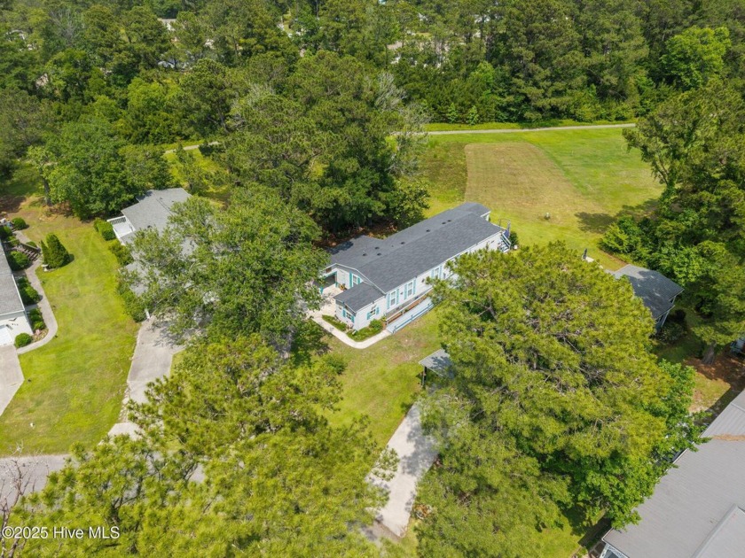 Welcome to your dream retreat in the serene community of Topsail - Beach Home for sale in Hampstead, North Carolina on Beachhouse.com