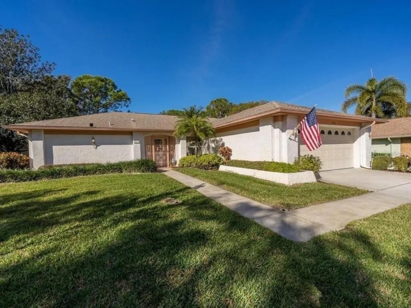 Nestled in the highly sought-after 55+ community of Highland - Beach Home for sale in Palm Harbor, Florida on Beachhouse.com