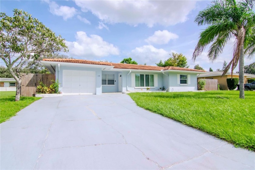 This beautifully remodeled 3-bedroom, 2-bath home features an - Beach Home for sale in Clearwater, Florida on Beachhouse.com