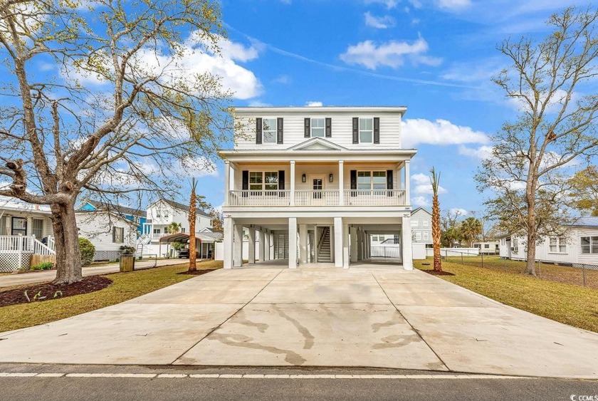Embrace the ultimate beach lifestyle at this charming coastal - Beach Home for sale in Murrells Inlet, South Carolina on Beachhouse.com