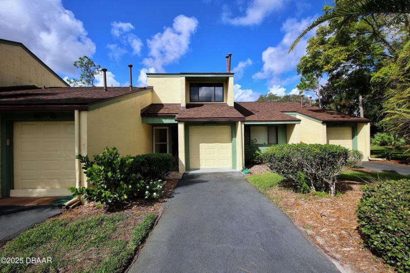 Nestled in the highly sought-after Sugar Mill Golf Townhomes - Beach Townhome/Townhouse for sale in New Smyrna Beach, Florida on Beachhouse.com