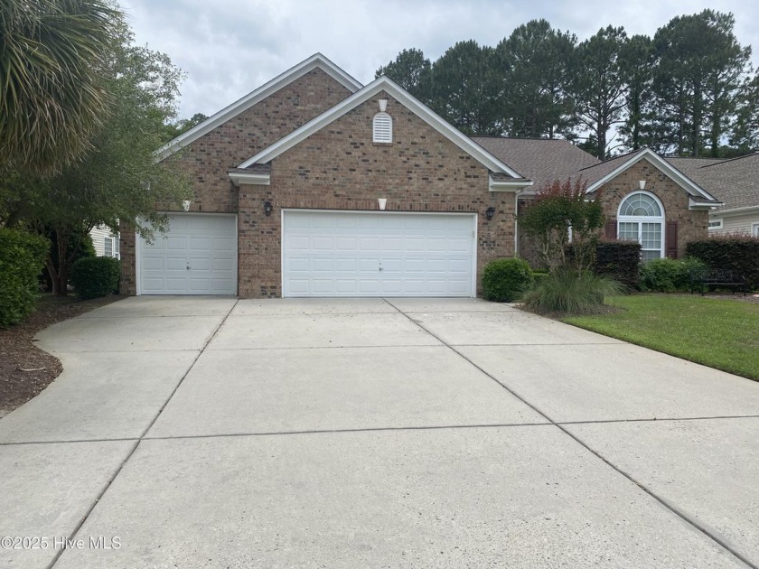Looking for the home with a 3-car garage, water views, and golf - Beach Home for sale in Sunset Beach, North Carolina on Beachhouse.com