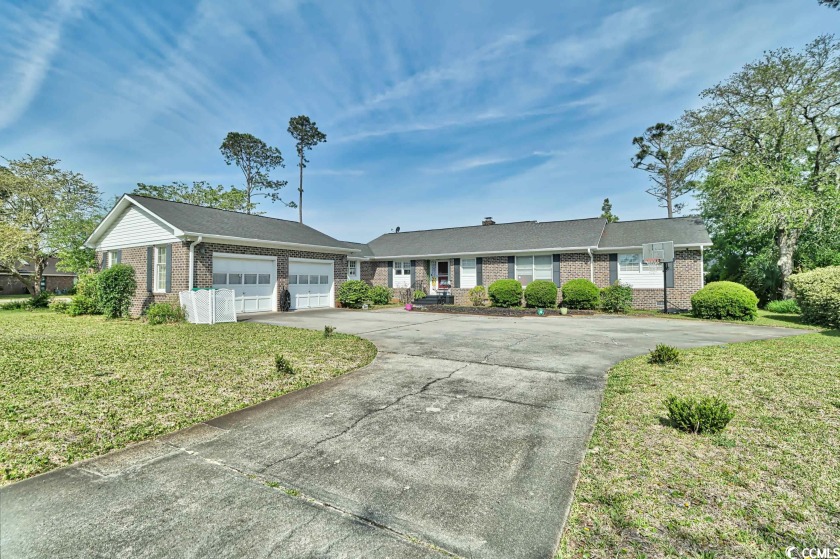 This 4 bedroom home, reminiscent of a mid century modern ranch - Beach Home for sale in Surfside Beach, South Carolina on Beachhouse.com