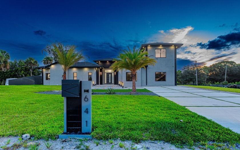 This stunning 2-story home on a .61- acre lot offers 4 spacious - Beach Home for sale in West Palm Beach, Florida on Beachhouse.com