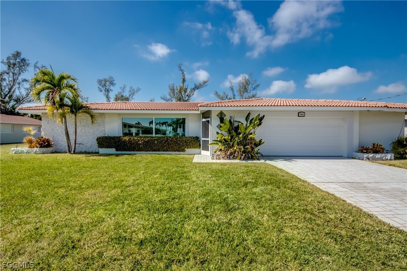 Welcome to this gorgeous single-family pool home nestled on an - Beach Home for sale in Cape Coral, Florida on Beachhouse.com