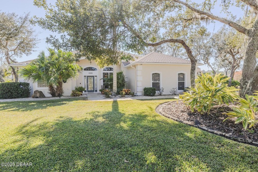 Lushly landscaped Halifax Plantation pool home meticulously - Beach Home for sale in Ormond Beach, Florida on Beachhouse.com