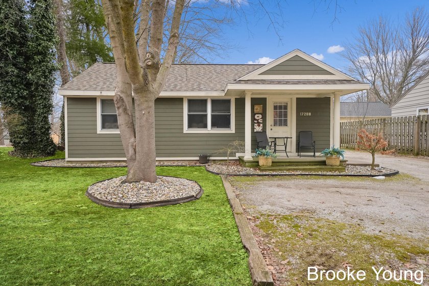 This adorable 2 bedroom home is right on the bike path and sits - Beach Home for sale in Spring Lake, Michigan on Beachhouse.com