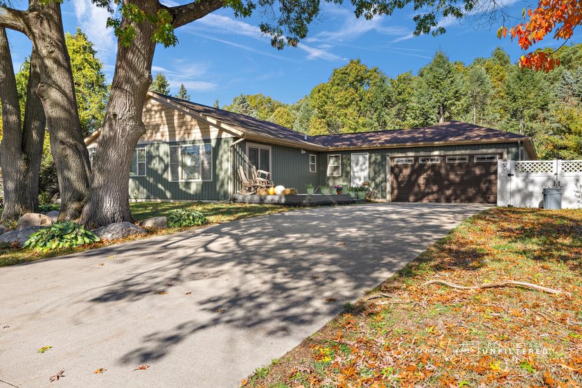 This beautifully updated home features newer siding, roof - Beach Home for sale in Spring Lake, Michigan on Beachhouse.com