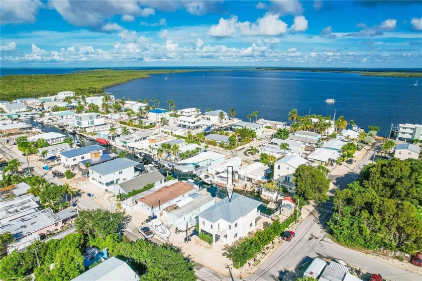 Discover this stunning canal-front home in Key Largo, just 45 - Beach Home for sale in Key Largo, Florida on Beachhouse.com