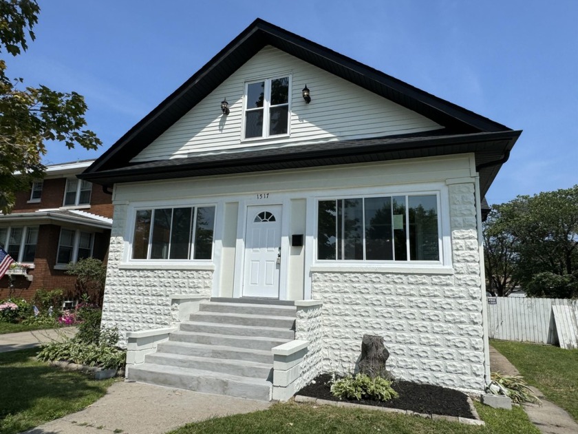 Step into the charm and comfort of this exquisitely renovated - Beach Home for sale in Whiting, Indiana on Beachhouse.com