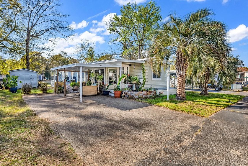 LOCATION, LOCATION, LOCATION!  Backing up to the large lake - Beach Home for sale in Murrells Inlet, South Carolina on Beachhouse.com