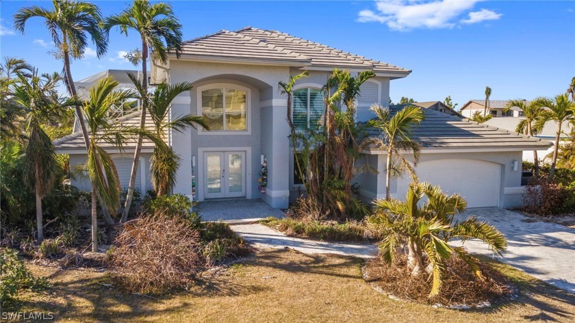You'll find this stunning home located along a wide direct - Beach Home for sale in Sanibel, Florida on Beachhouse.com