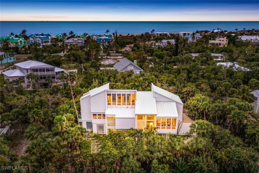 This architectural masterpiece, designed by the acclaimed Bruce - Beach Home for sale in Sanibel, Florida on Beachhouse.com