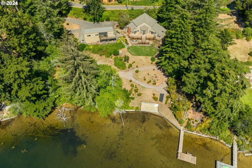 Rare South-facing Woahink Lakefront home with boat dock! 1-acre - Beach Home for sale in Florence, Oregon on Beachhouse.com