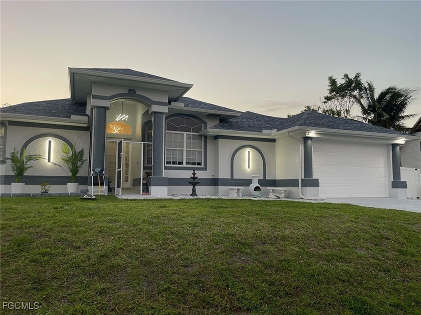 Welcome to this beautiful 4-bedroom, 3-bathroom home sitting on - Beach Home for sale in Cape Coral, Florida on Beachhouse.com